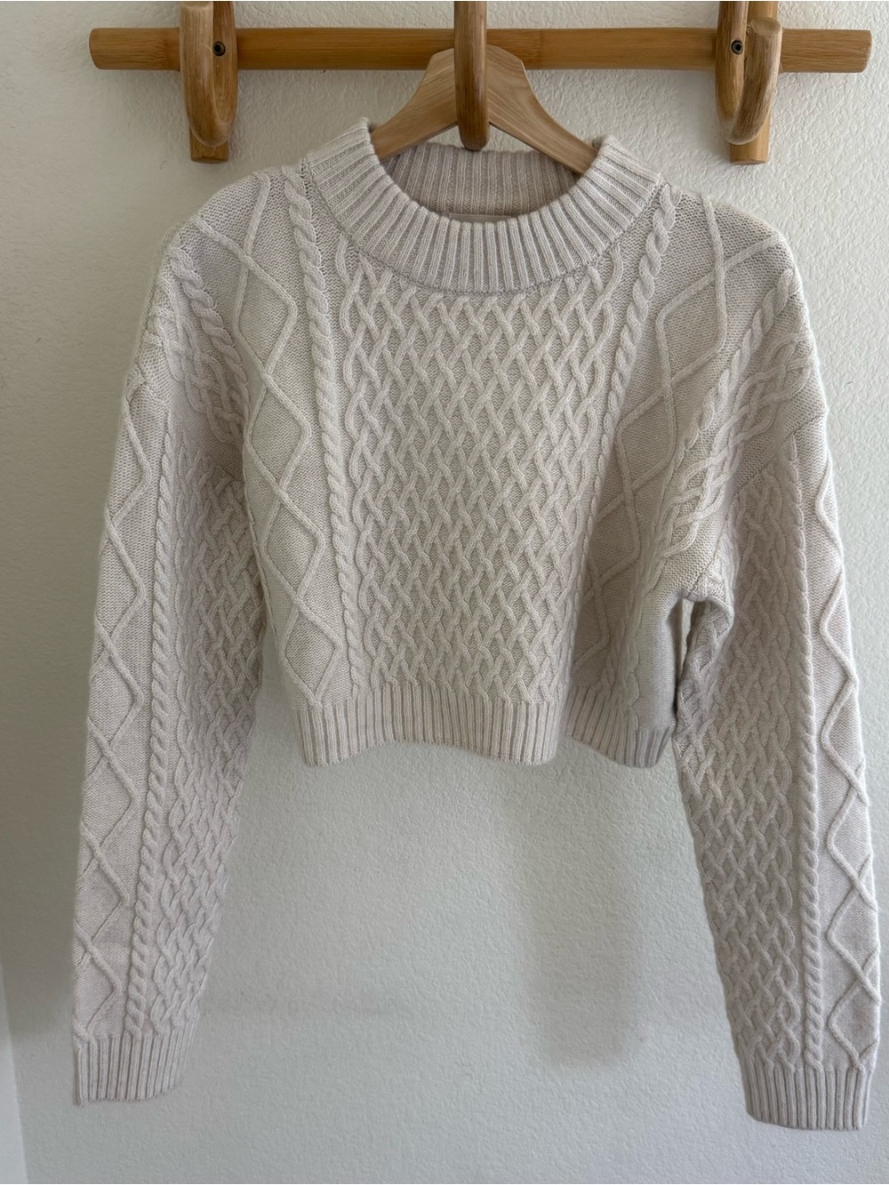 Clean girl capsule wardrobe minimalist preppy cream cable knit cropped sweater